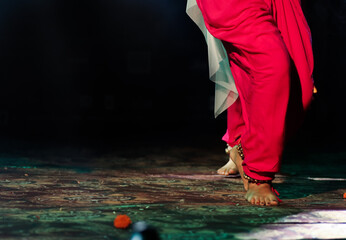 indian classical dance form in feet with musical anklet with selective focus and blur