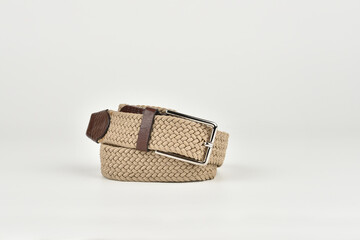 Trouser braided beige belt on a white background