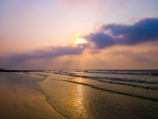 vivid sunrise on a serene calm tranquil deserted beach at digha puri mandarmani with space for text