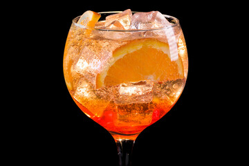 aperol spritz alcoholic cocktail in a glass with ice and lemon,