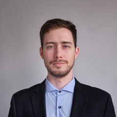 passport photo of cute and well dressed Caucasian man in jacket shirt or suit and tie