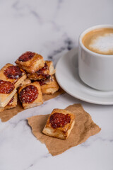 quince cookies on marble board with coffee