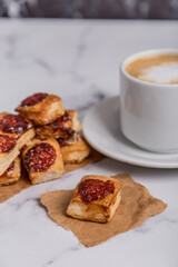 quince cookies on marble board with coffee