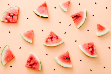 Watermelon pieces pattern on color background. Flat lay, top view