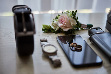 different accessories of a businessman for creating a style of a people lie on a wooden background
