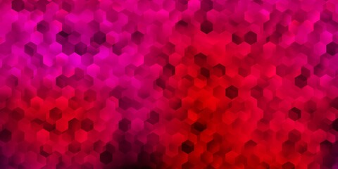 Light pink vector backdrop with a batch of hexagons.
