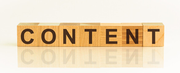 Content word text on wooden cube blocks on white background. Digital marketing concept.