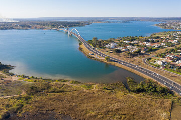 Naklejka premium Aerial view of Brasilia's JK bridge and its South Lake neighborhood.