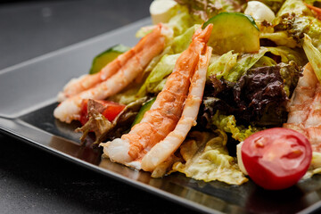 Fresh seafood salad served with prawns (shrimps )