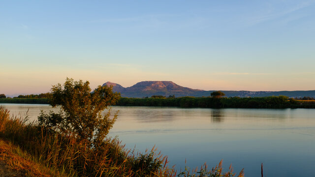 Plain mountains landscape in Montgri Catalonia at the end of Ter River sunrise landscape