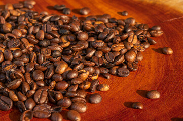 roasted coffee beans on wood, short depth of field