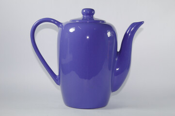 Blue ceramic milk jug with white background
