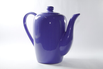 Blue ceramic milk jug with white background