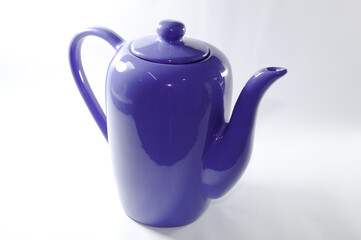 Blue ceramic milk jug with white background