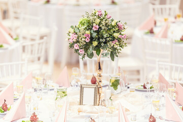 Wedding flower bouquet on a decorated festive table