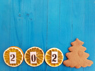 2021 inscription on orange slices. Number 1 in the form of a Christmas tree made of cookies . Gingerbread.