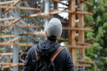 Man looking up at the top of the lookout tower
