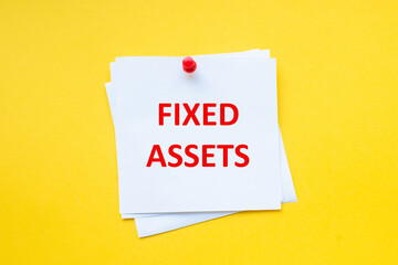 Fixed assets. Word on white sticker with yellow background