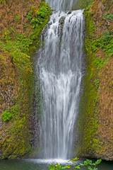 Fototapeta na wymiar Tumbling Waters on a Volcanic Cliff