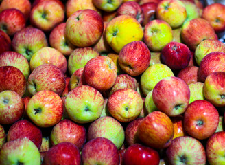 heap of apple for sale in market