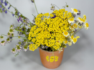 wild flowers in a ceramic cup