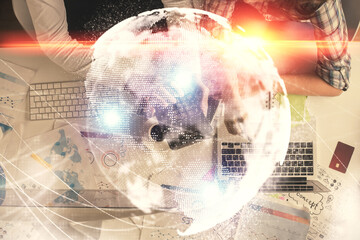 Double exposure of man and woman working together and business theme hologram drawing. Computer background. Top View.