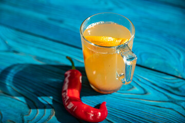 Fruit tea in a transparent cup. In the coffee shop
