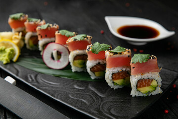 Japanese rolls with salmon, tuna on a wooden table
