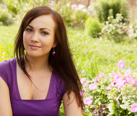 Fototapeta premium young woman outdoor in the grass in summertime