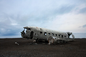 Plane wreck at sunrise on a black sand beach in Iceland