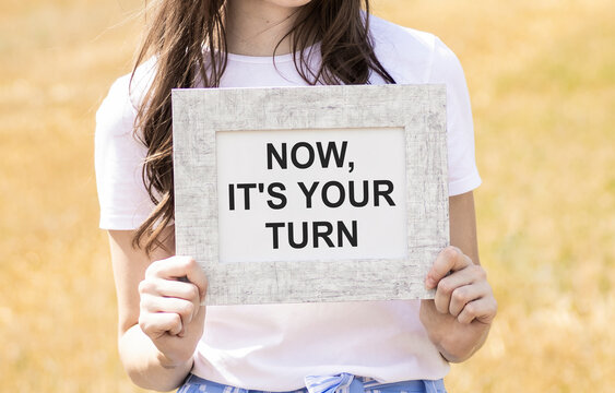 Now it's your turn to write text, an inscription, a phrase in a frame that the girl is holding in her hands. Business concept.