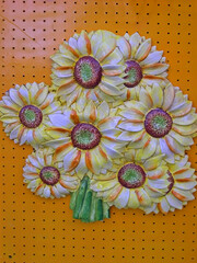 Italy, Marche, Loreto ceramic flower on sale in the village market.