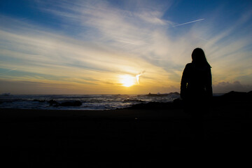 Obraz na płótnie Canvas silhouette of a person at sunset