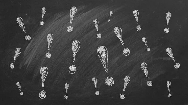 Exclamation marks drawn in chalk on a blackboard
