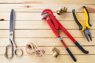 domestic plumber accessories set on a wooden desk. tools for housework