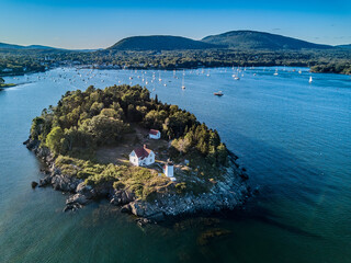 Obraz premium Aerial Drone image of the Curtis Island Lighthouse att he entrance to Camden Harbor on Penobscot Bay in Maine on a late afternoon