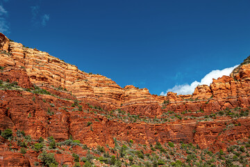 Clouds show their head above the giant red rocks, Sedona, AZ, USA