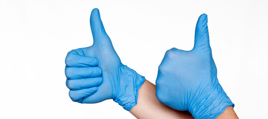 Hands in Medical Blue Latex Gloves Giving Thumbs Up Sign. Like. White background. Protection concept