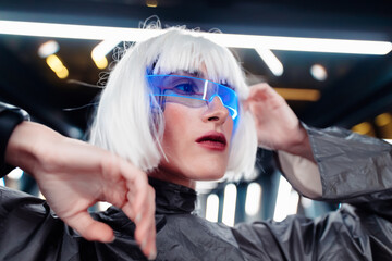 Woman in neon glasses. Cyberpunk and the future