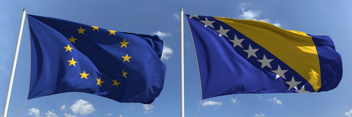 Waving flags of the European Union and Bosnia and Herzegovina on flagpoles, 3d rendering