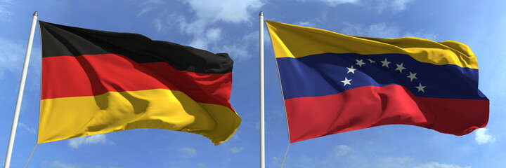 Flying flags of Germany and Venezuela on sky background, 3d rendering