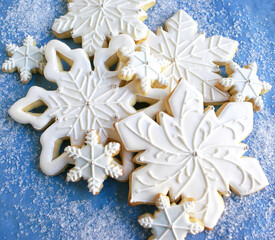 Decorated White and Blue Cut-Out Snowflake Sugar Cookies for Holidays and Winter
