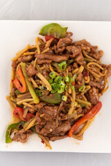 Appetizing plate tempting the tastebuds with Pork Szechuan style in perfect serving size.