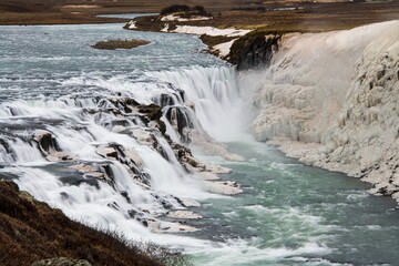 Gullfoss waterfall with rocks and sea foam in Iceland