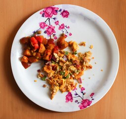 scrambled egg omlette and mixed vegetable served on a plate. Indian home made dish. view from top