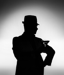 Romantic man enjoying a glass of wine and beautiful sunset view. Man drinking glass of cocktail....