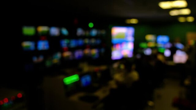 Professional sound engineer's console. Television Broadcast, working with video and audio mixer, control broadcast in recording studio. blurred background, monitors.