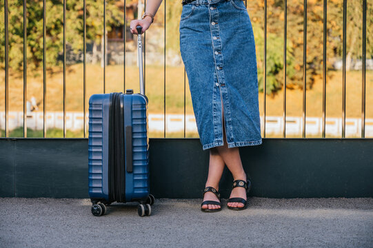 Woman with a suitcase outdoors