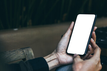 cell phone mockup blank white screen.woman hand holding texting using mobile on desk at coffee shop.background empty space for advertise.work people contact marketing business,technology