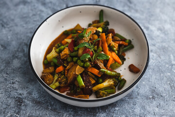 plant-based food,  vegan asian inspired stir fry with plant-based protein
